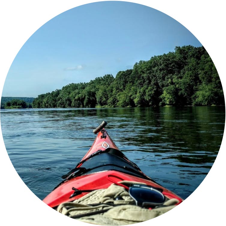 Places To Go - Photograph of the Front of a Canoe Floating in the Water on a Sunny Day in the D&R Canal